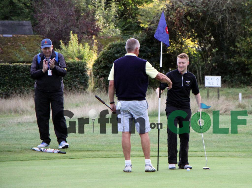 Henry Lloyd shakes Dave Edmunds hand after winning their County Sevens match at the 20th at Petersfield Golf Club